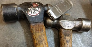 picture of a hand stamp and hammers